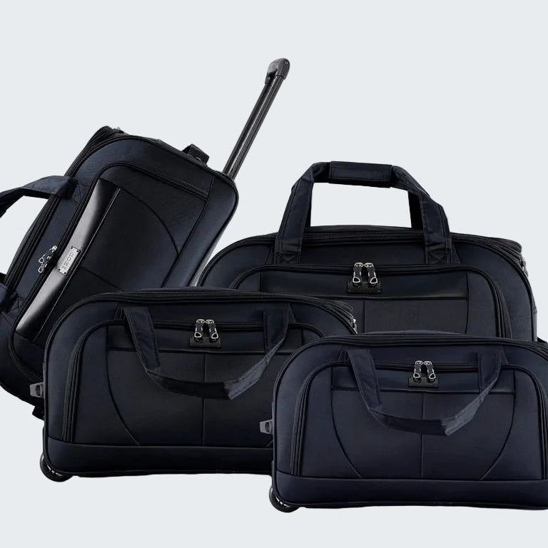 Set of black suitcases of different sizes on a white background
