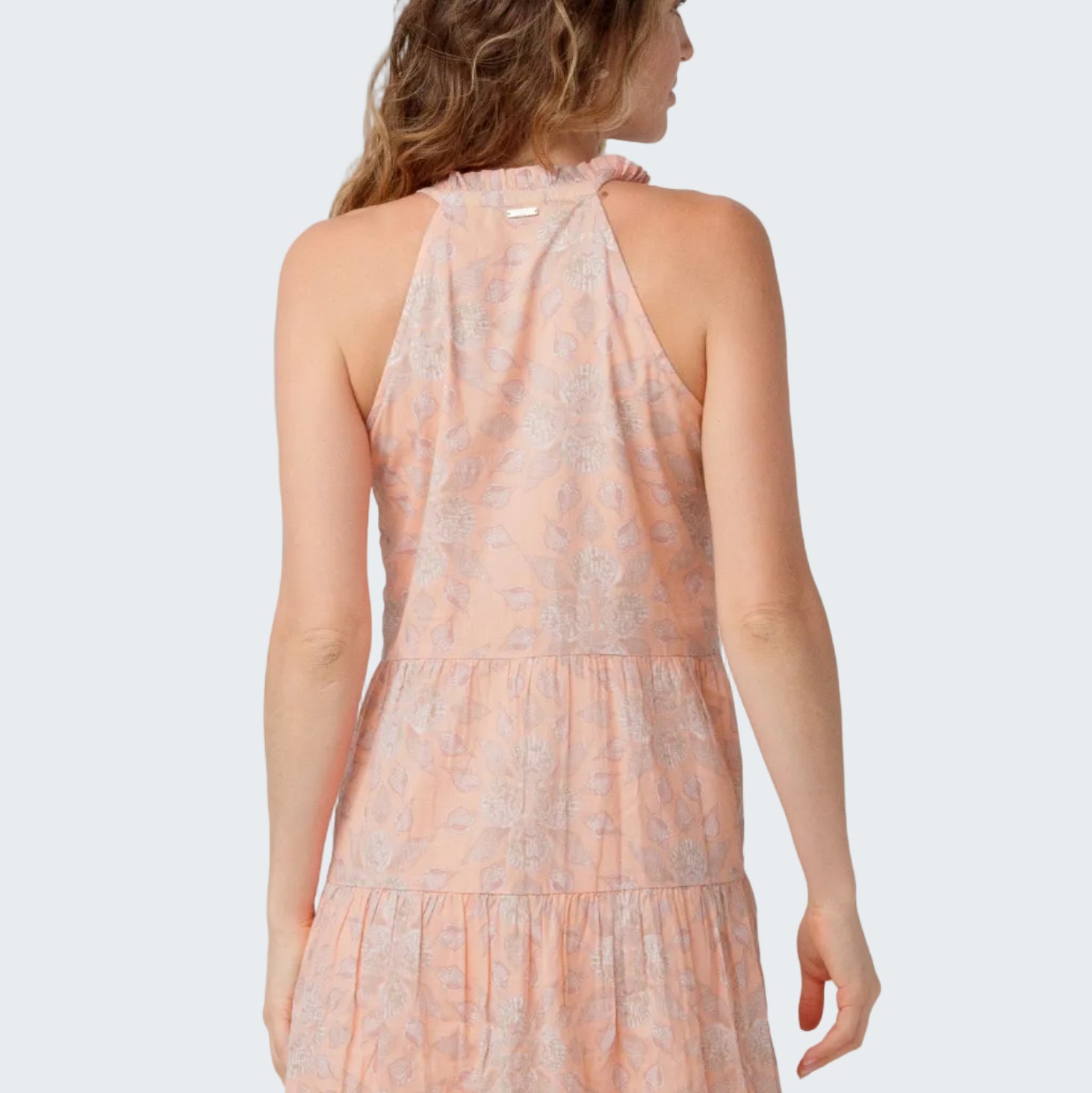 Woman wearing a floral dress on a white background