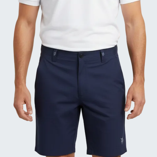 Person wearing navy shorts and a white polo shirt on a white background