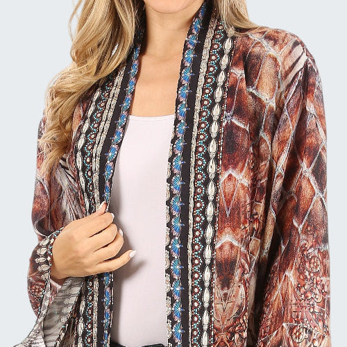 Long, patterned cardigan worn by a person on a white background