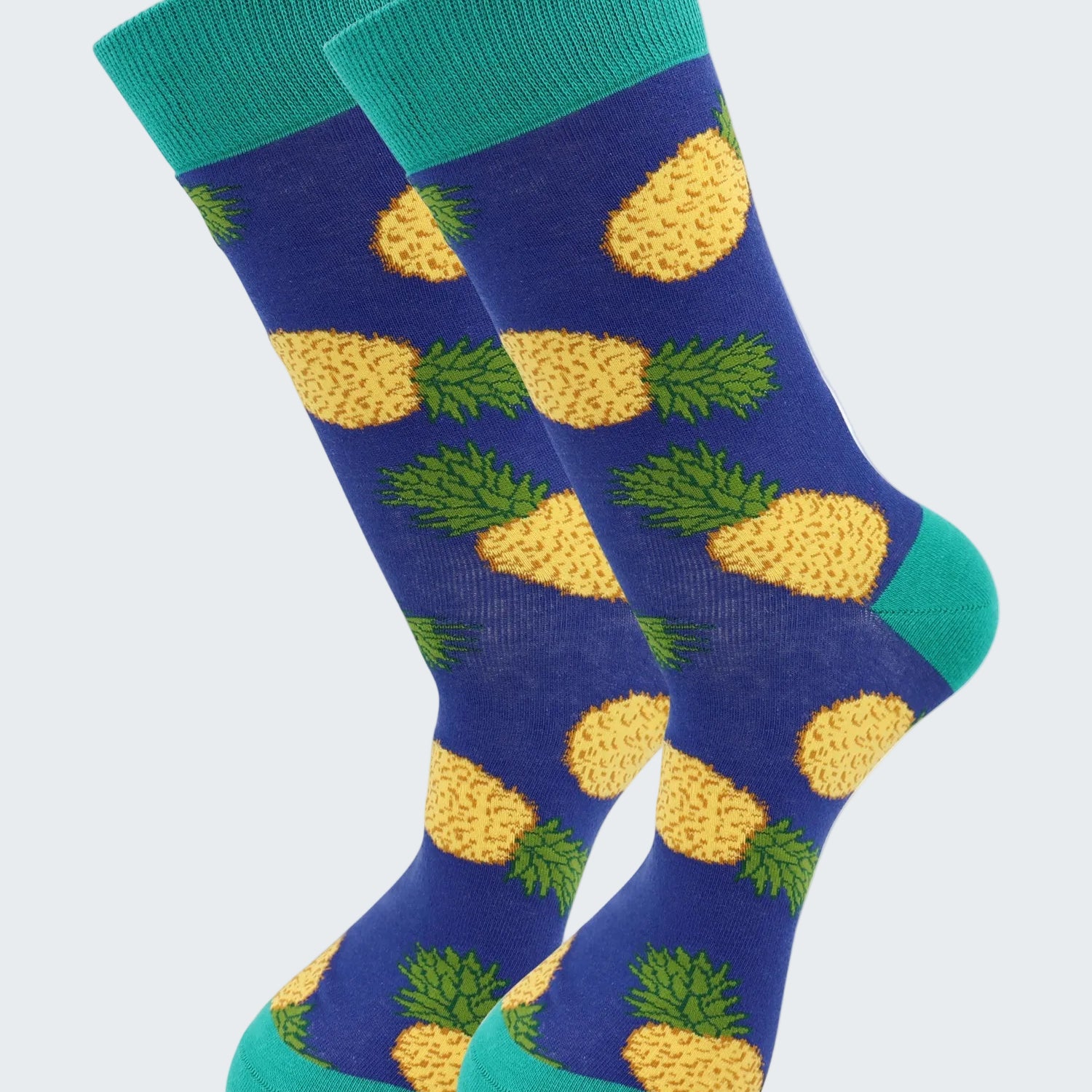 Pair of socks with pineapple pattern on a white background