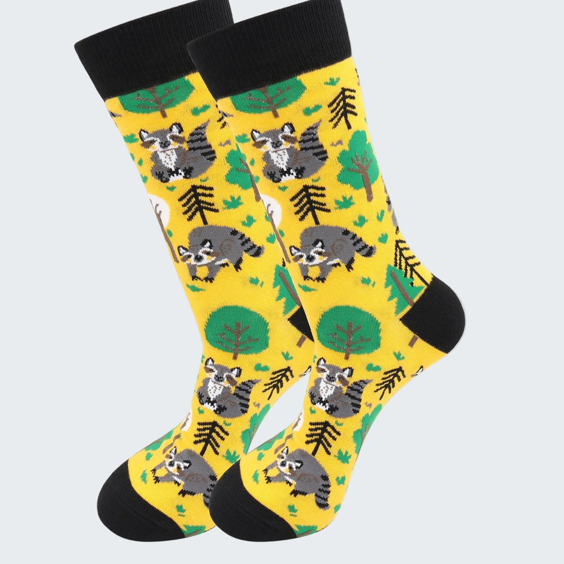 Yellow socks with raccoon pattern on a white background