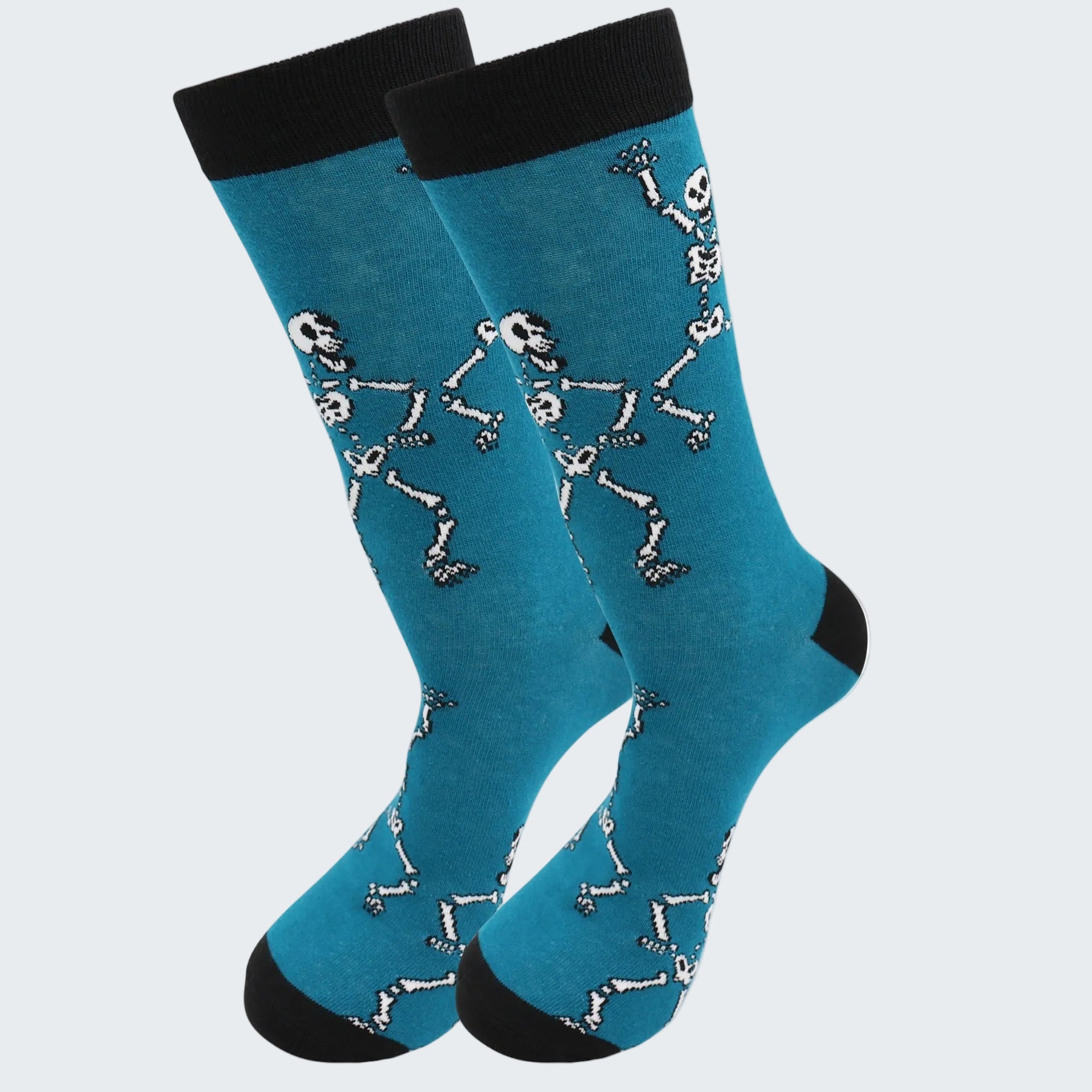 Blue socks with skeleton design and black cuffs on a white background