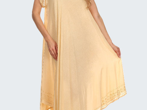 Woman wearing a light yellow dress with lace sleeves on a white background