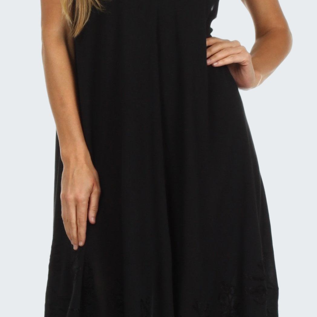 Black sleeveless dress worn by a model on a white background