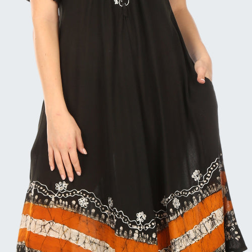 Black dress with orange and white patterns on a white background