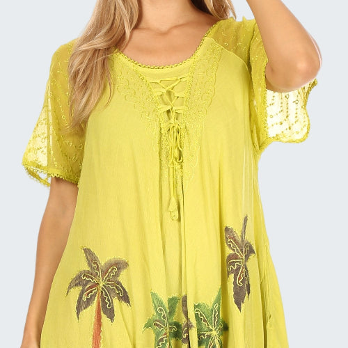 Yellow dress with palm tree patterns on a white background