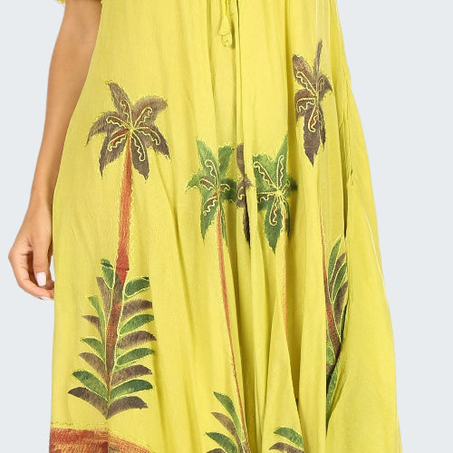 Yellow dress with palm tree patterns on a white background