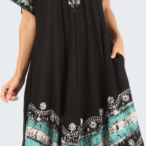 Black dress with floral patterns on a white background
