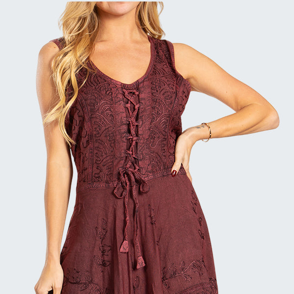 Woman wearing a burgundy lace dress on a white background
