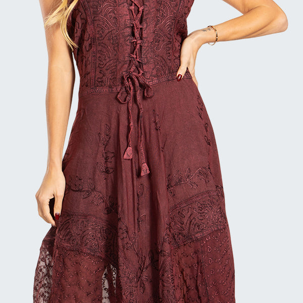 Woman wearing a burgundy lace dress on a white background