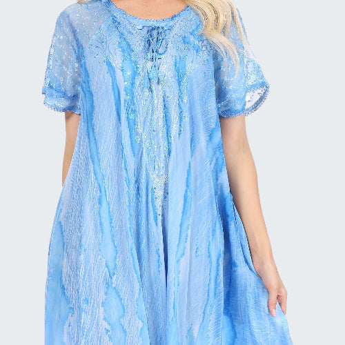 Woman wearing a light blue dress with short sleeves on a white background