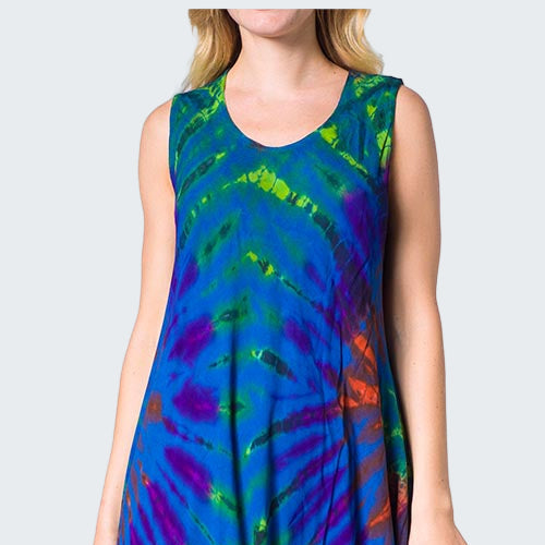 Woman wearing a colorful tie-dye dress on a white background