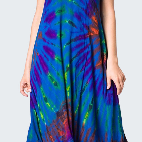 Woman wearing a colorful tie-dye dress on a white background