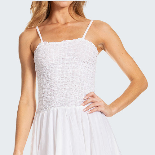 White dress with thin straps on a white background