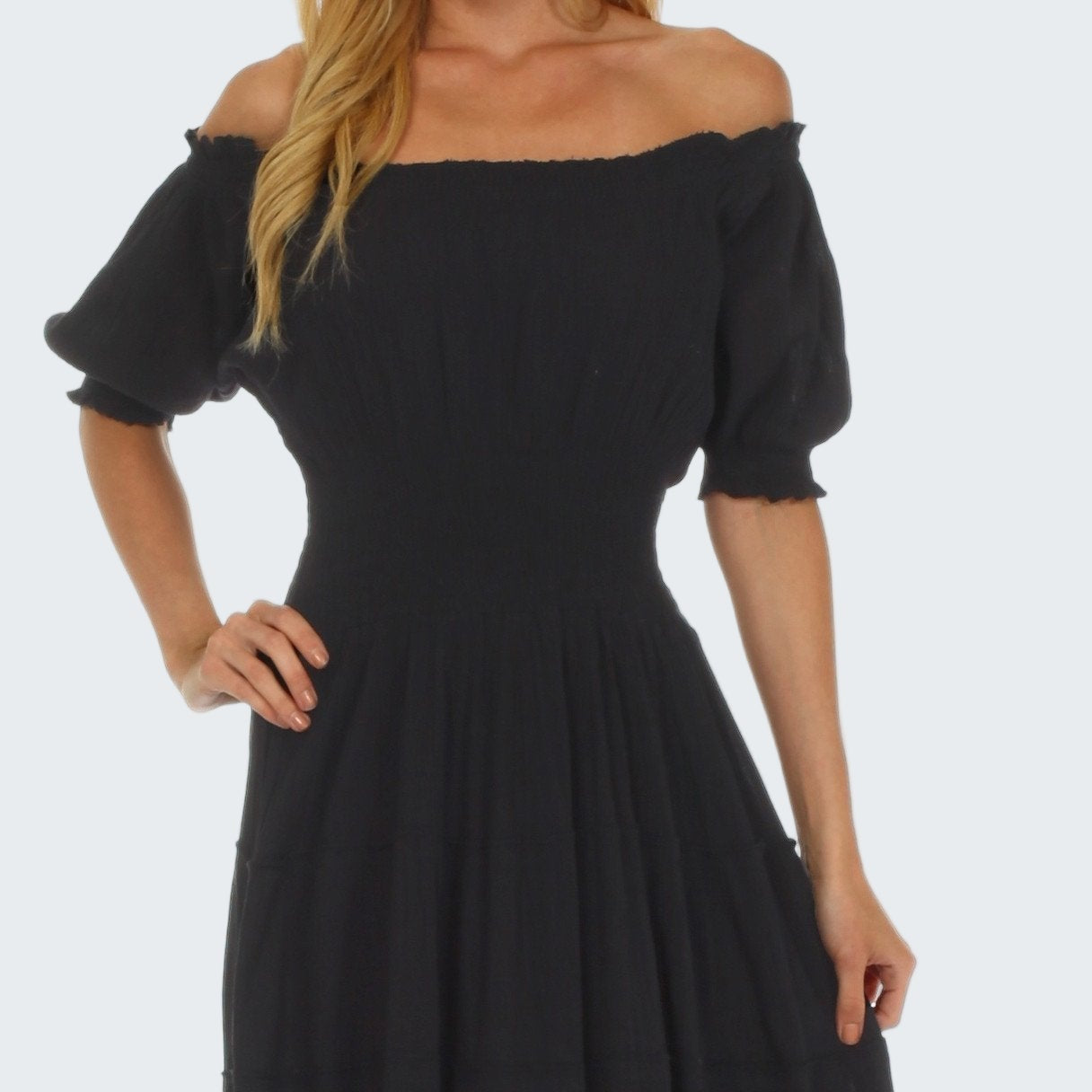 Black off-shoulder dress on a white background