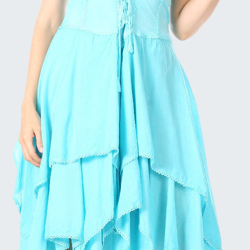 Woman wearing a light blue dress with a layered, hi-lo hem design.