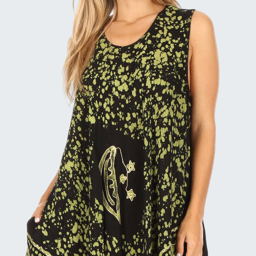 Black dress with yellow floral patterns worn by a model on a white background