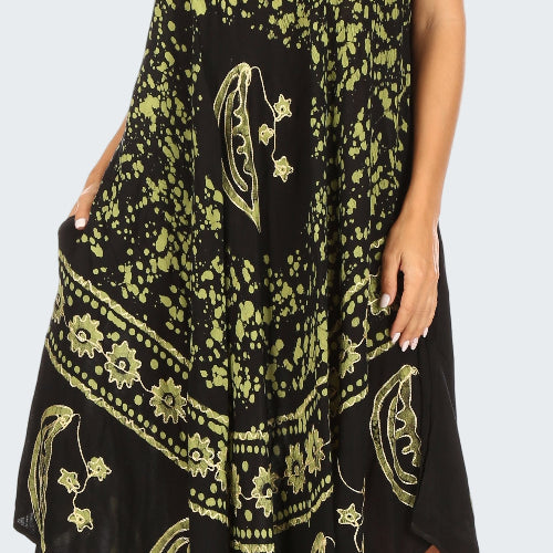 Black dress with yellow floral patterns worn by a model on a white background