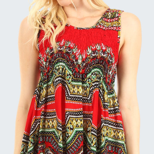 Red dress with colorful pattern worn by a person on a white background