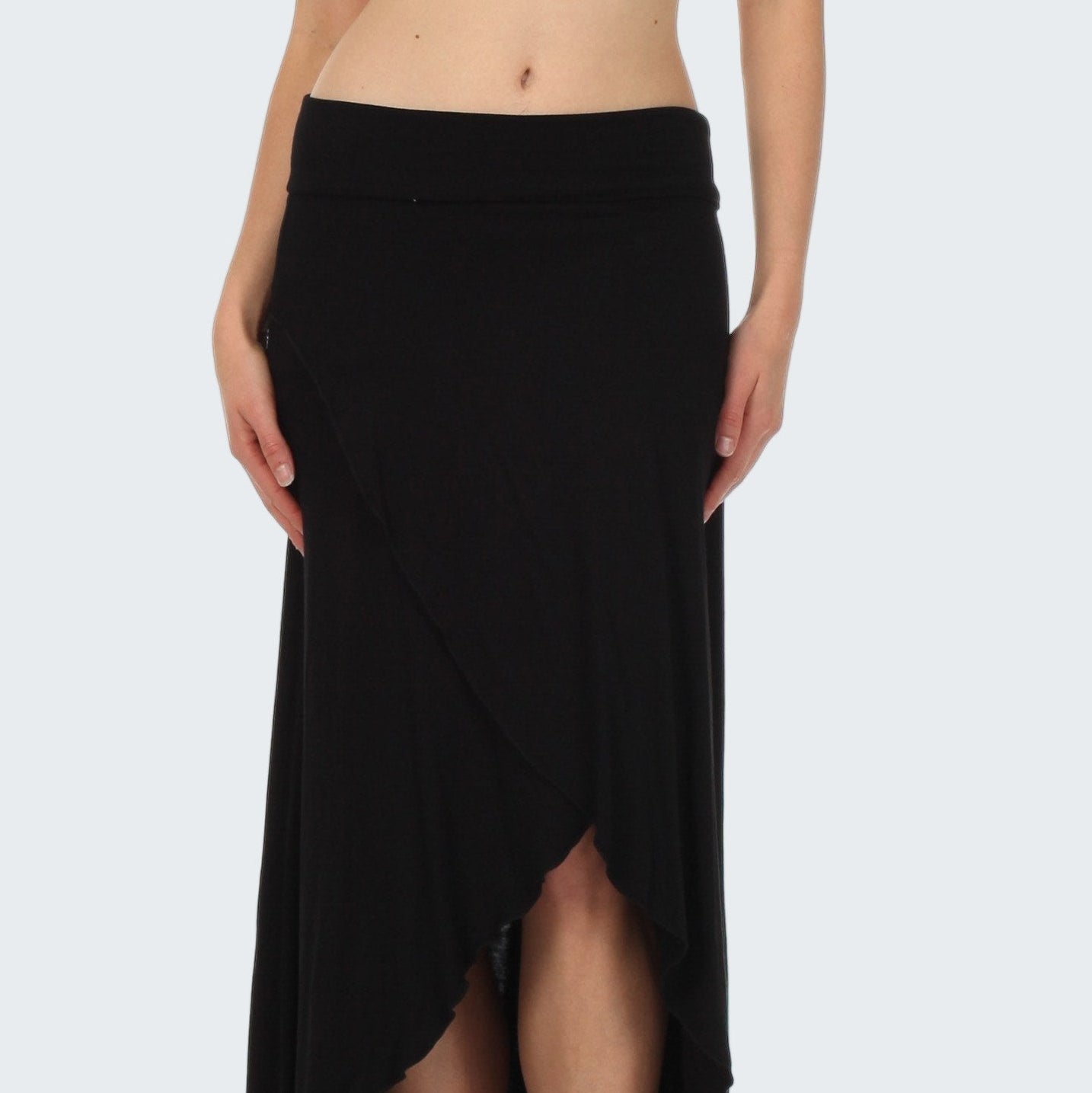 Black skirt worn by a person on a white background