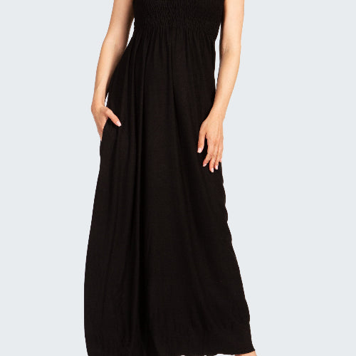 Black halter neck dress worn by a model on a white background