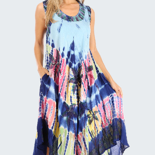 Woman wearing a tie-dye dress with a colorful pattern on a white background