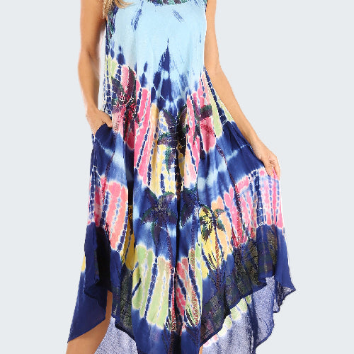 Woman wearing a tie-dye dress with a colorful pattern on a white background