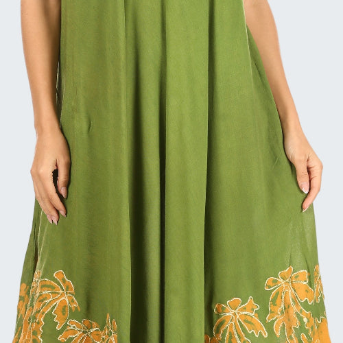 Green dress with yellow floral patterns on a white background