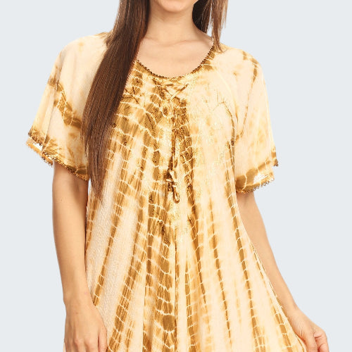 Woman wearing a yellow tie-dye dress on a white background