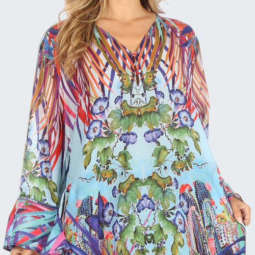 Colorful patterned dress with long sleeves on a white background