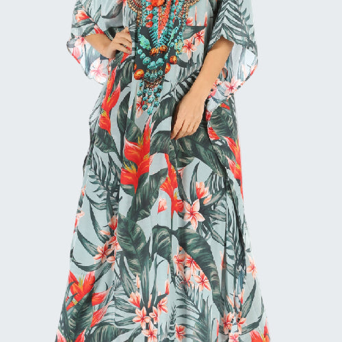 Long floral dress with a tropical pattern on a white background