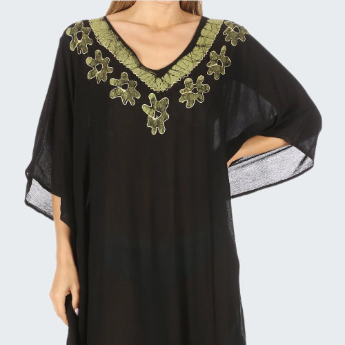 Black dress with green floral embroidery on a white background