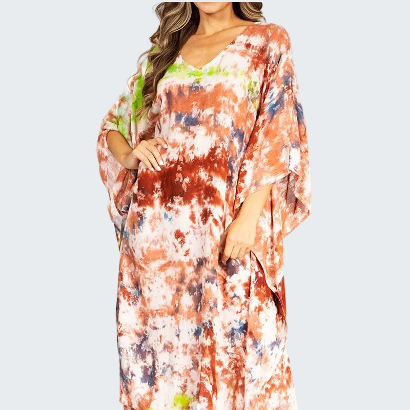 Woman wearing a colorful tie-dye dress on a white background