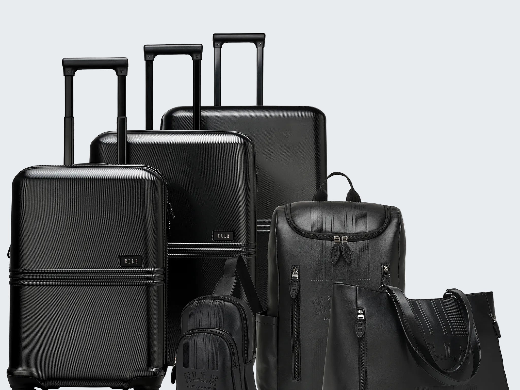 Set of black suitcases and bags on a white background