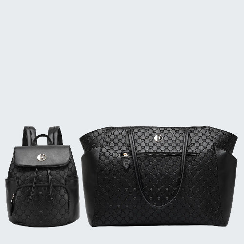 Black quilted backpack and tote bag on a white background
