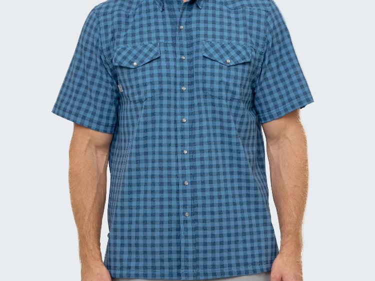 Man wearing a blue checkered short-sleeve shirt on a white background