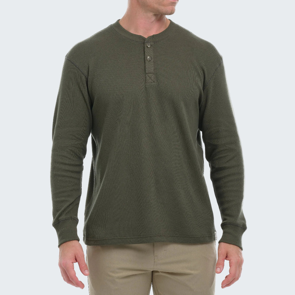 Green long-sleeve henley shirt worn by a person on a white background