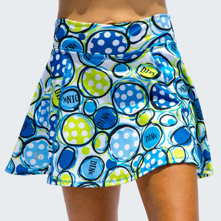 Colorful polka dot skirt with brand logo on a white background