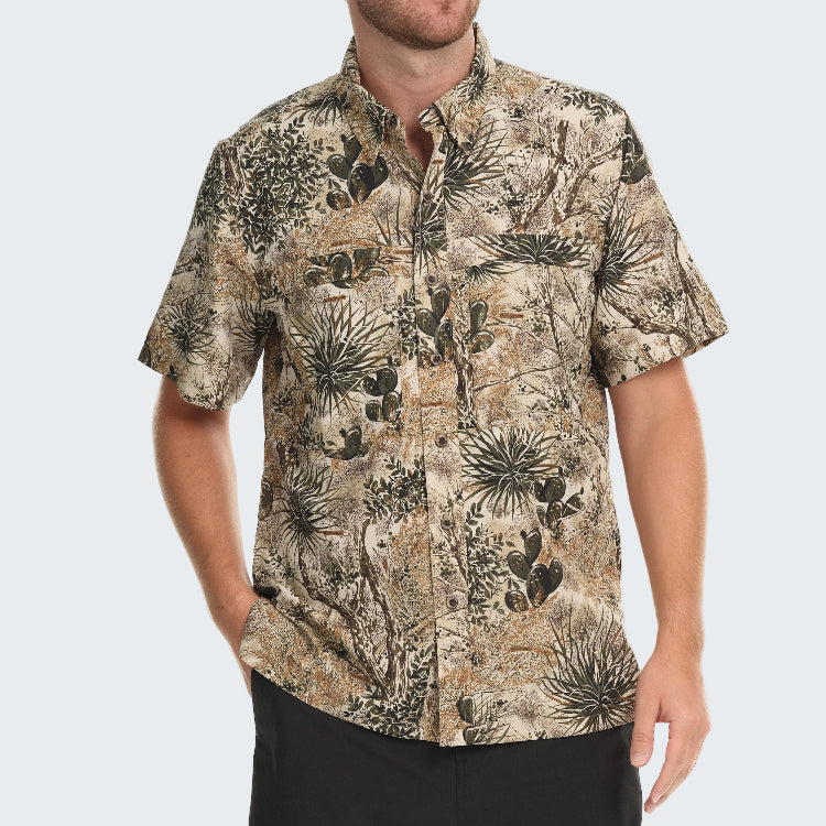 Man wearing a patterned shirt on a white background