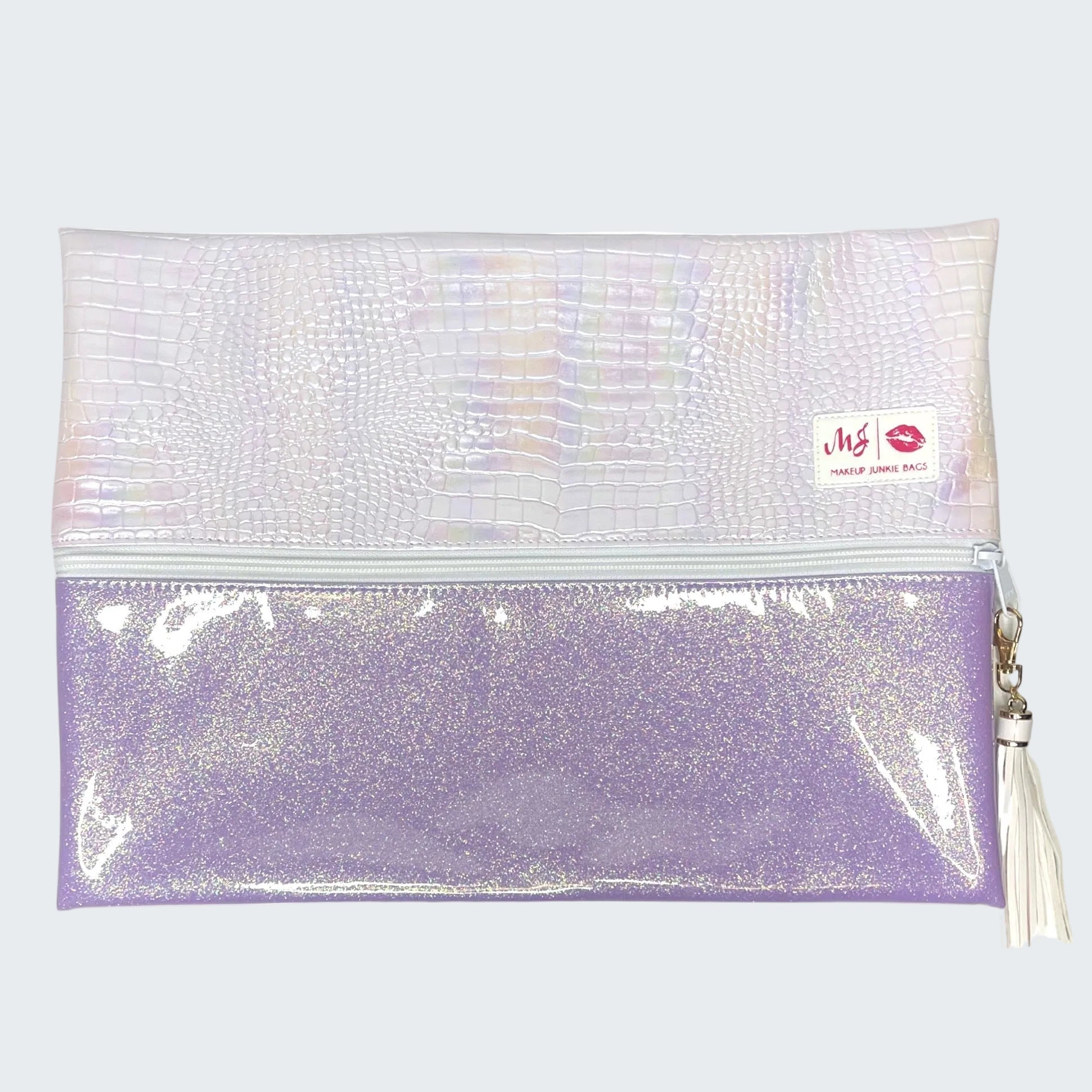 Makeup bag with a tassel on a white background