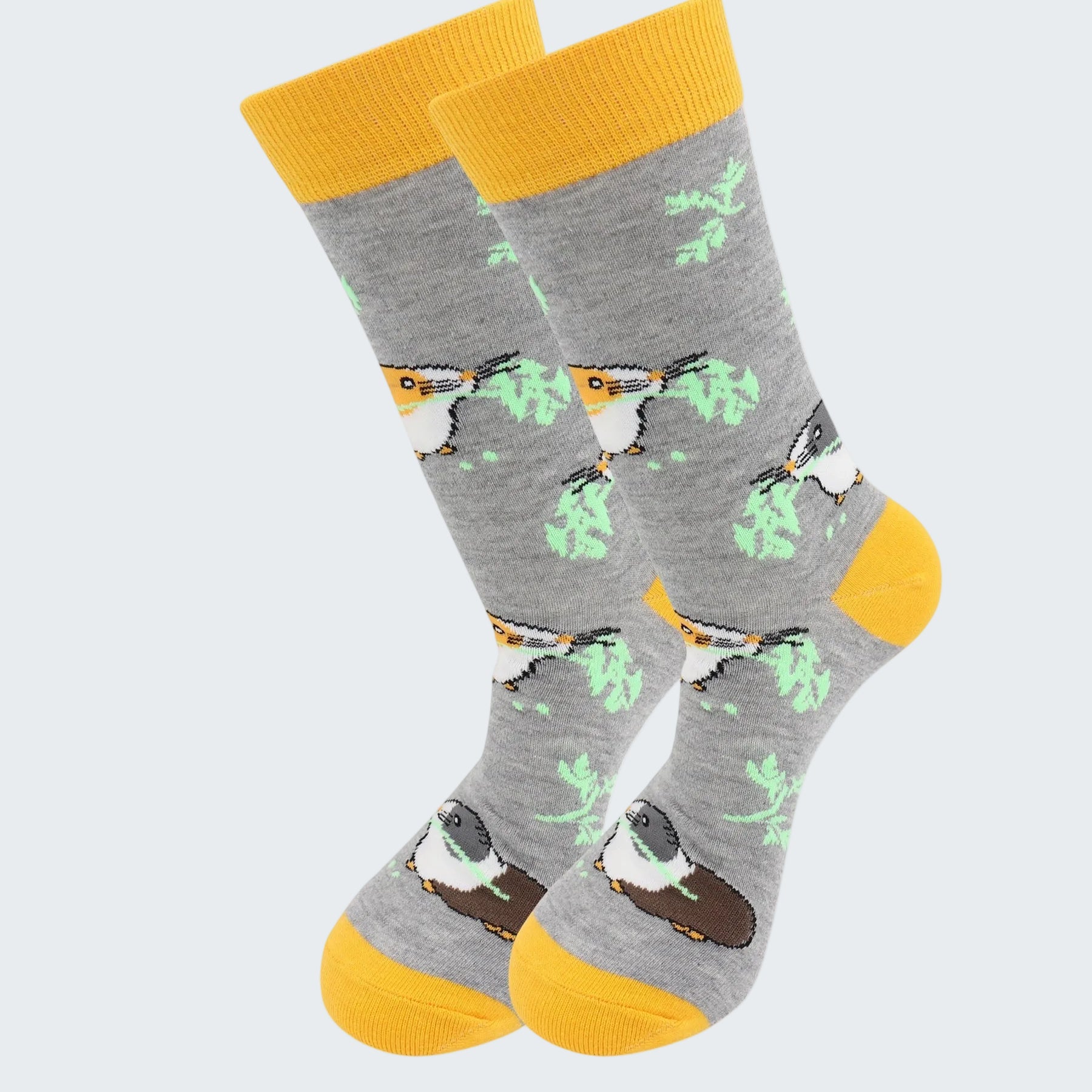 Gray socks with bird pattern and yellow accents on a white background