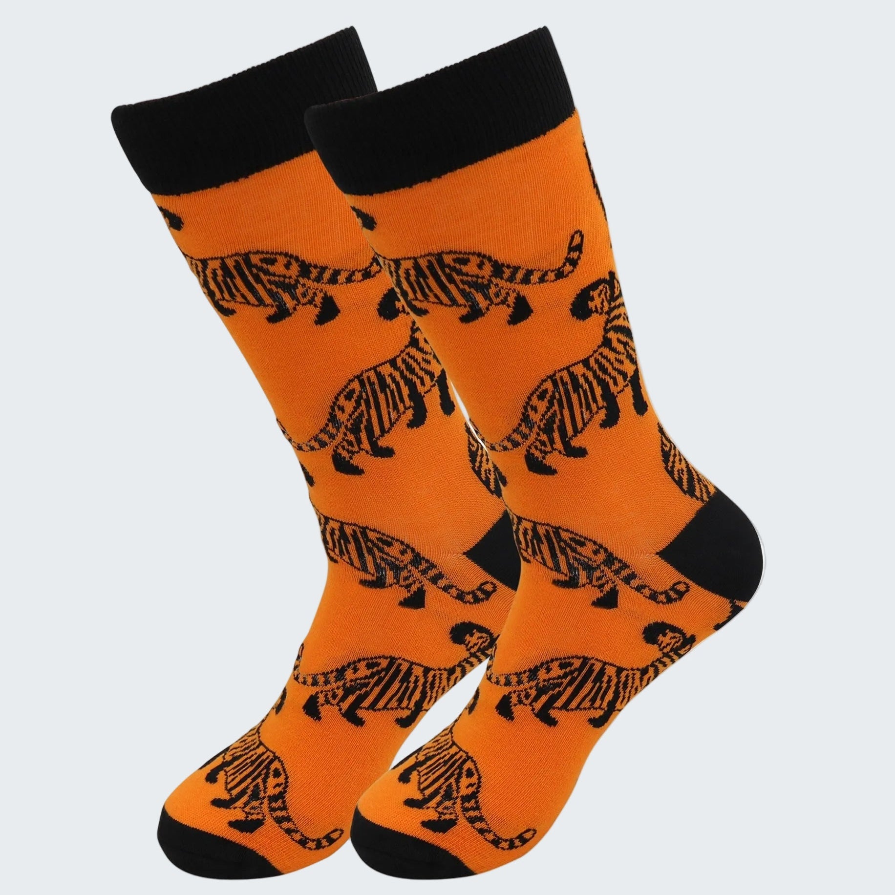 Orange socks with black tiger patterns on a white background