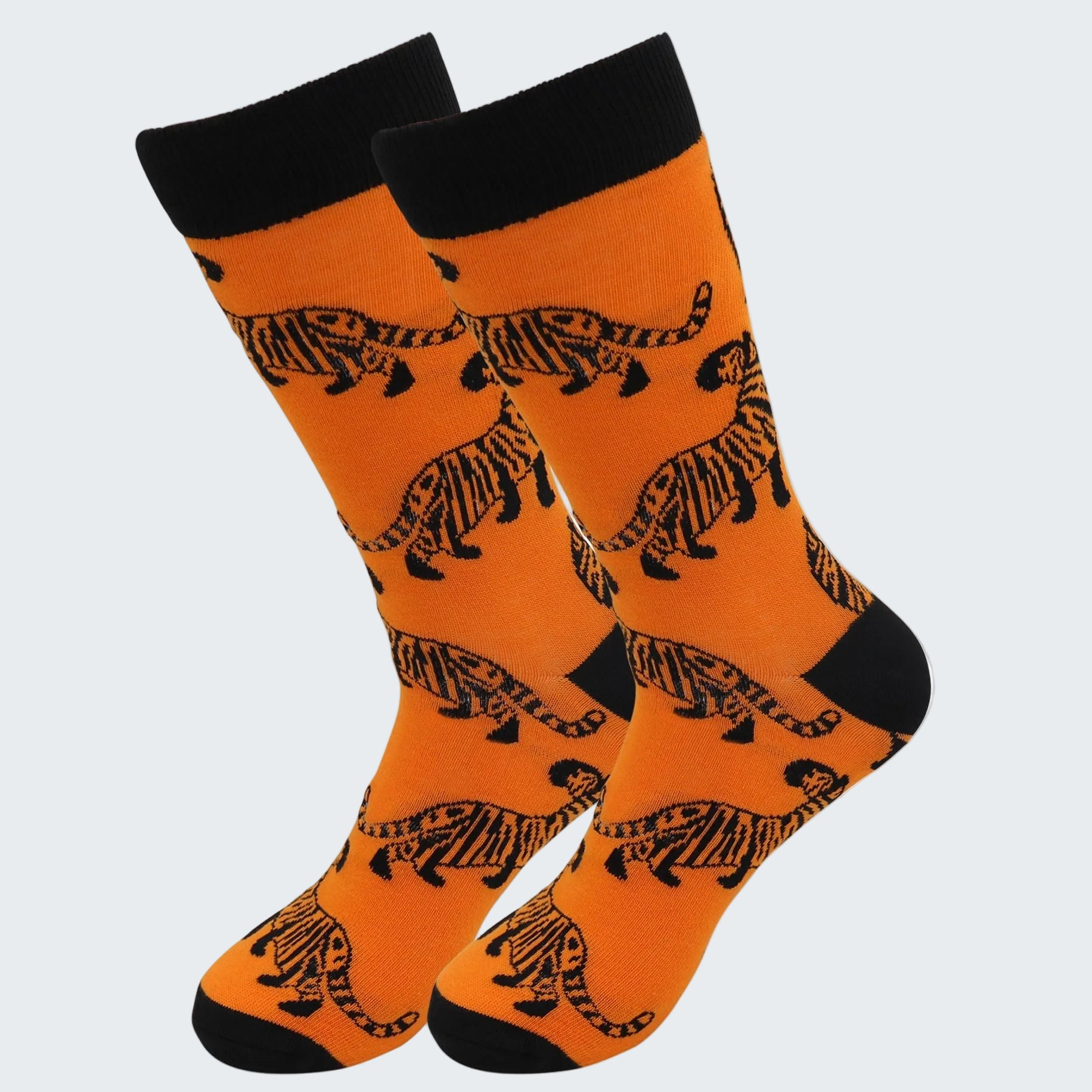 Orange socks with black tiger patterns on a white background