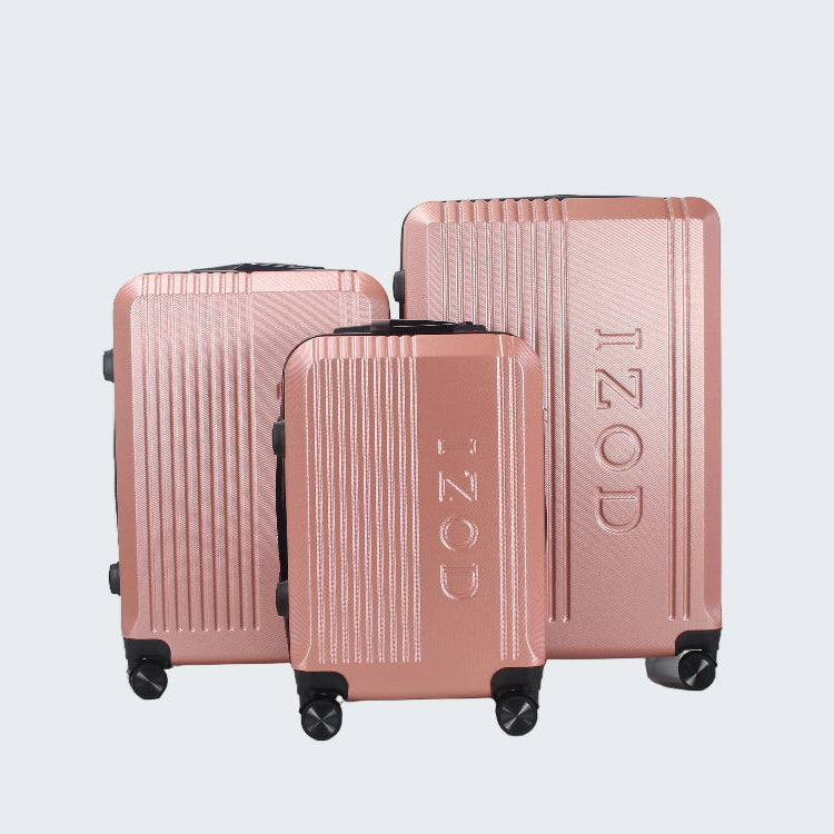 Set of three rose gold suitcases with 'IZOD' branding on a white background