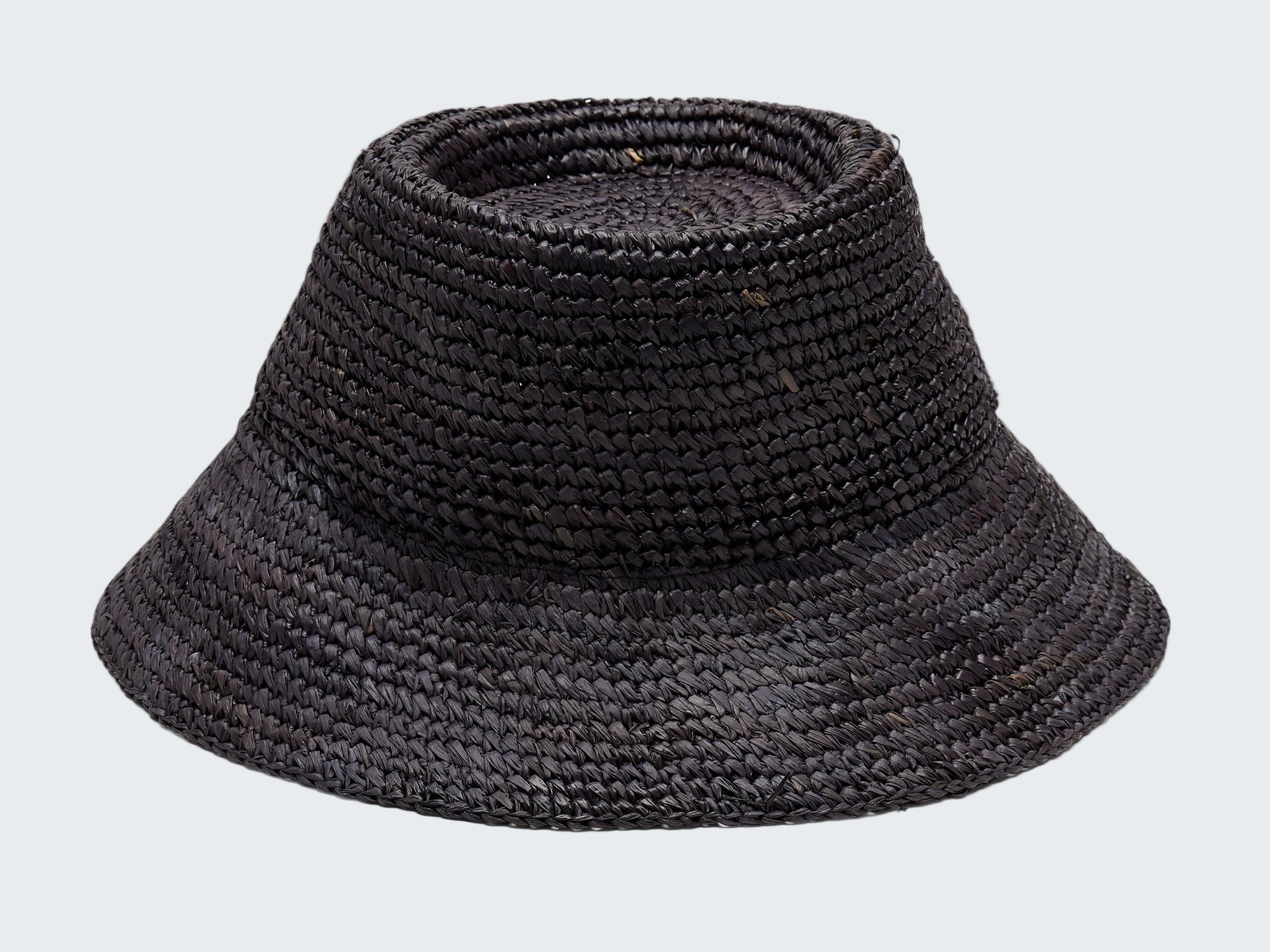 Black woven bucket hat on a light gray background