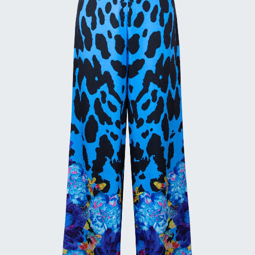 Blue pants with black leopard print and colorful butterfly design on a white background