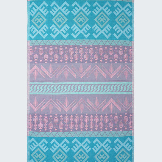 Patterned towel with blue and pink geometric design on a white background