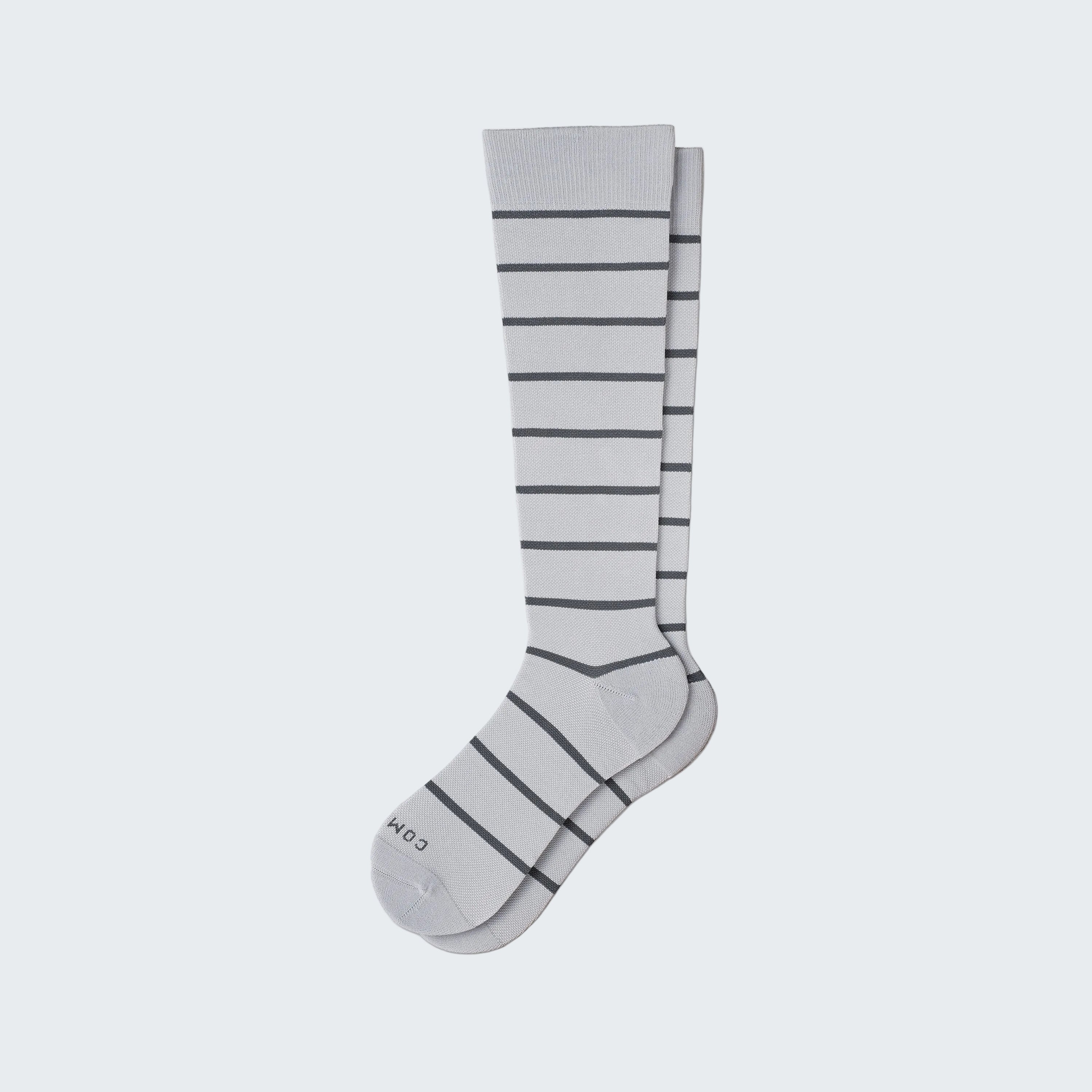 Gray knee-high sock with horizontal stripes on a white background