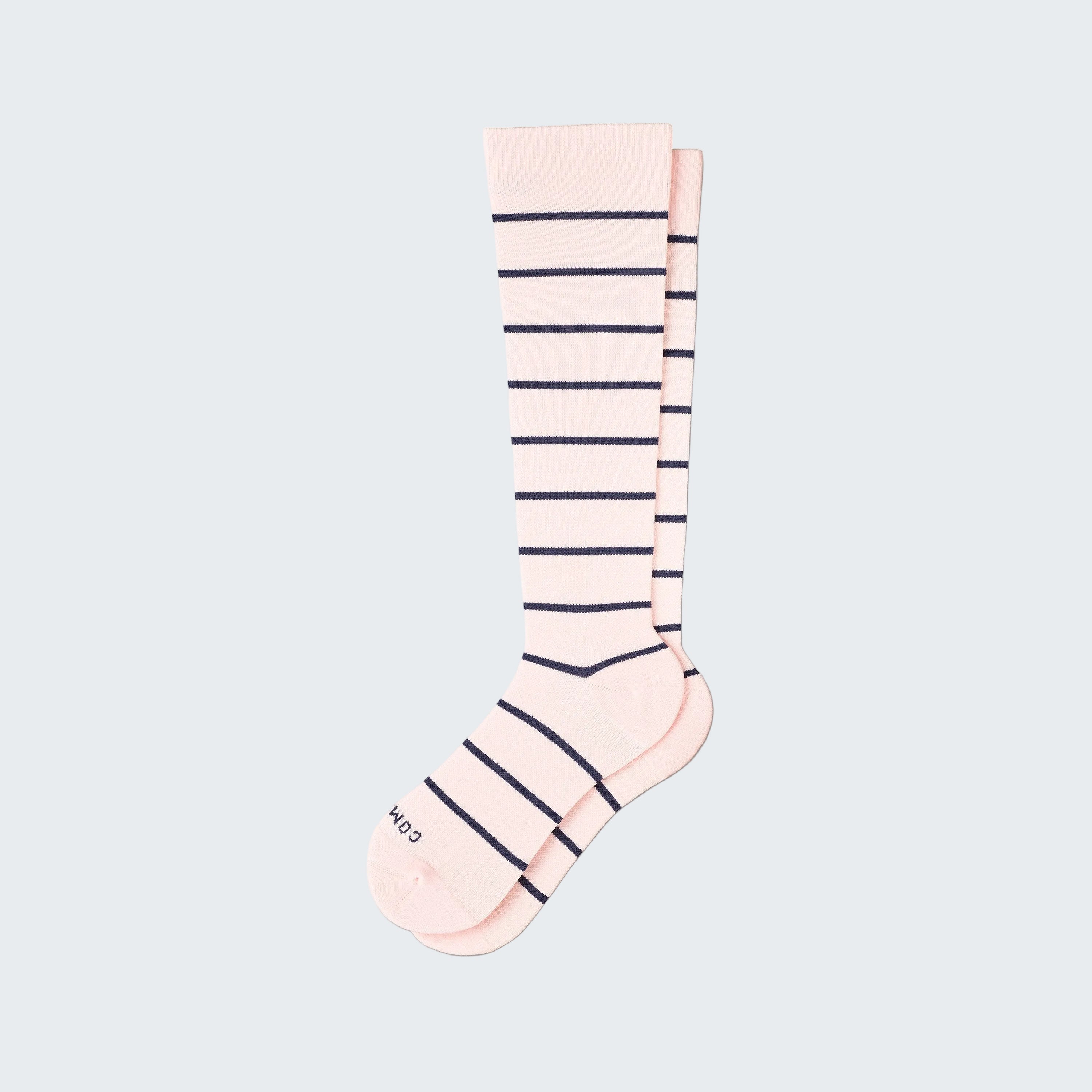 Pink knee-high sock with navy stripes on a white background